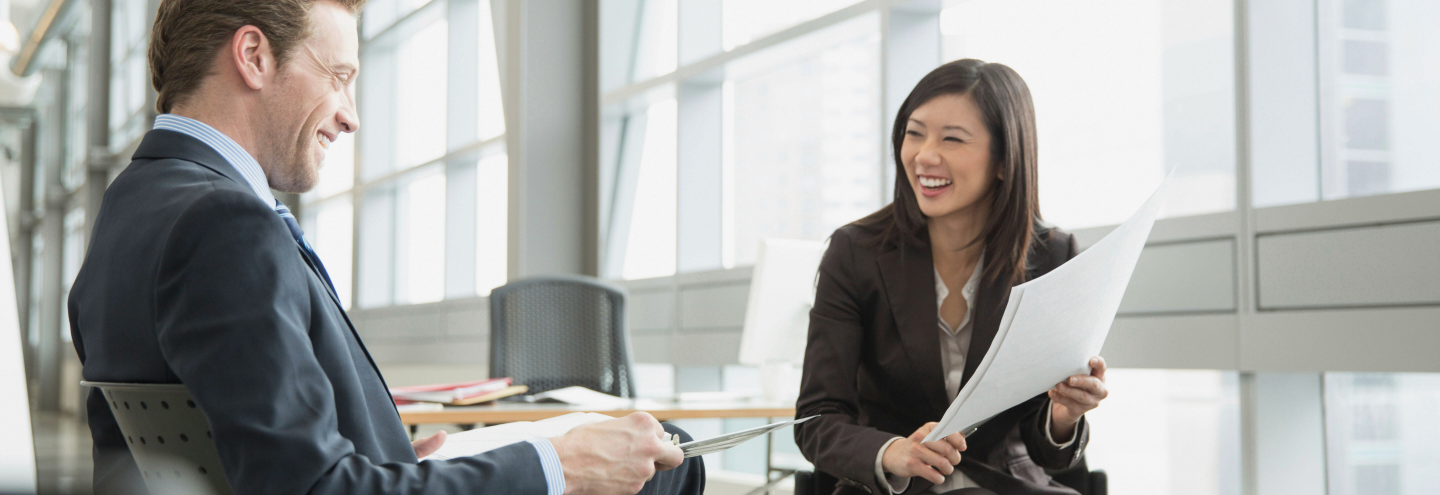 Husband and wife talk to their JT financial advisor 